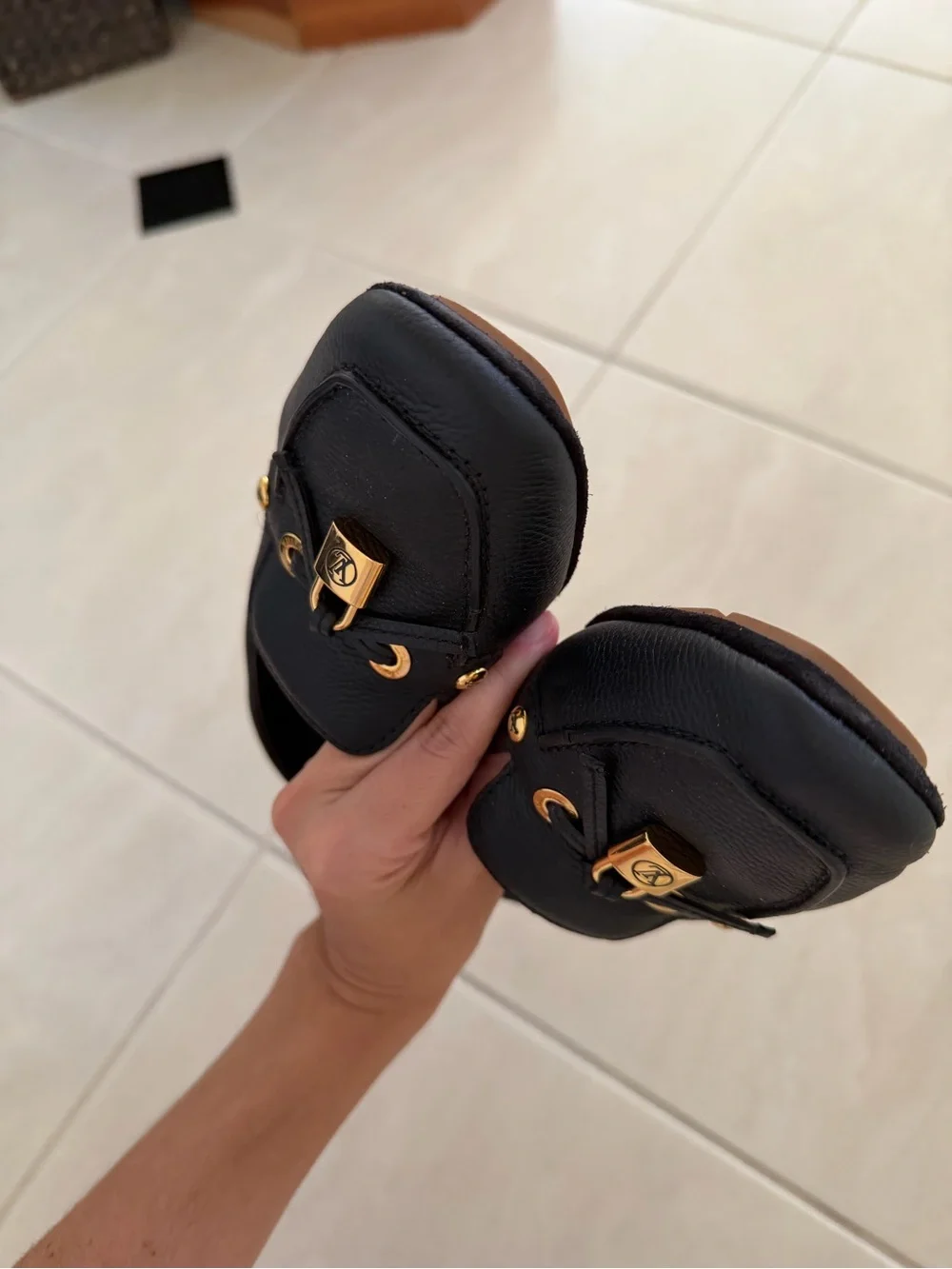 Louis Vuitton Black Leather Loafers with Gold Accent Hardware